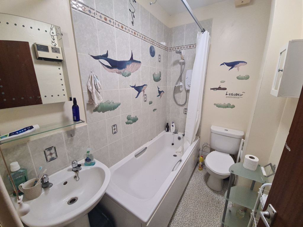 Property photo 3 of 4 Bright, Well-Kept Bathroom With A Bathtub And Show...
