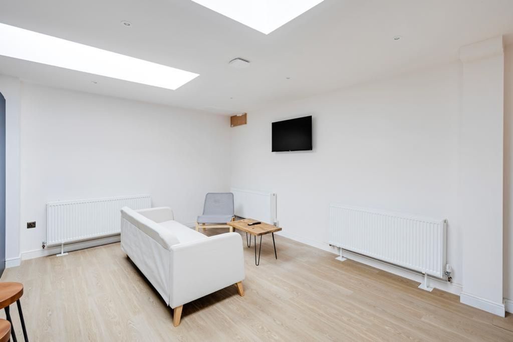 Property photo 3 of 5 A Bright And Clean Living Room Featuring A Modern ...