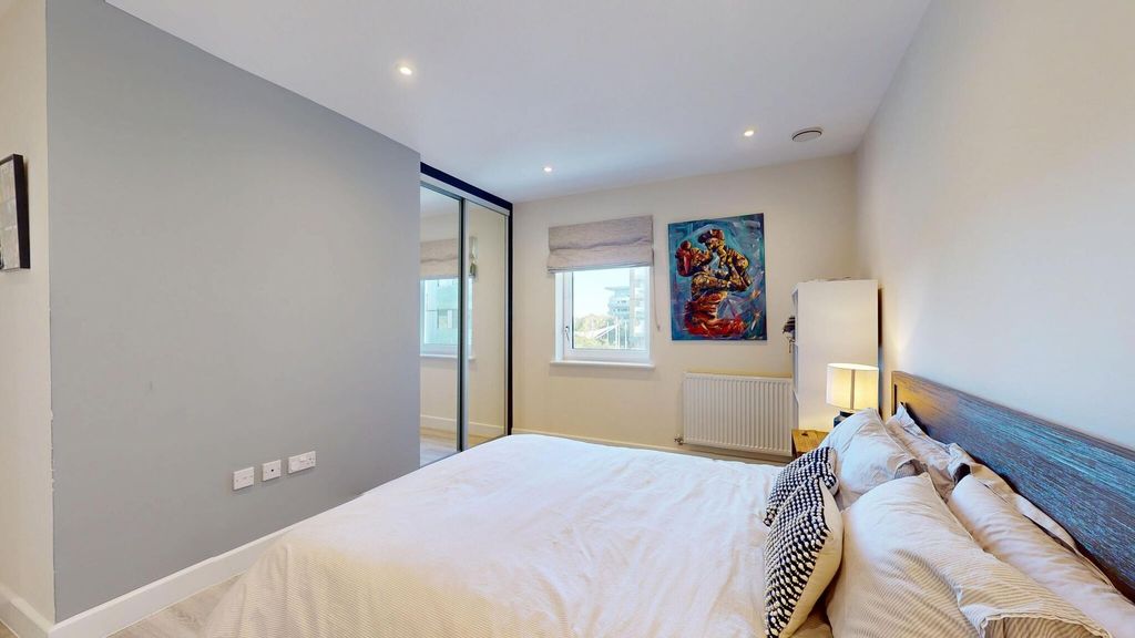 Property photo 3 of 15 A Spacious Master Bedroom Featuring A Comfortable ...