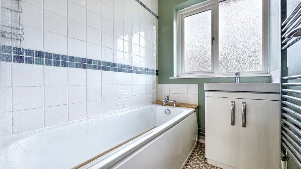 Property photo 2 of 14 Bright And Clean Bathroom Featuring A Full-Size Ba...