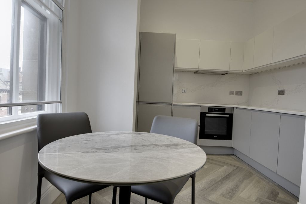 Property photo 3 of 12 Kitchen Area