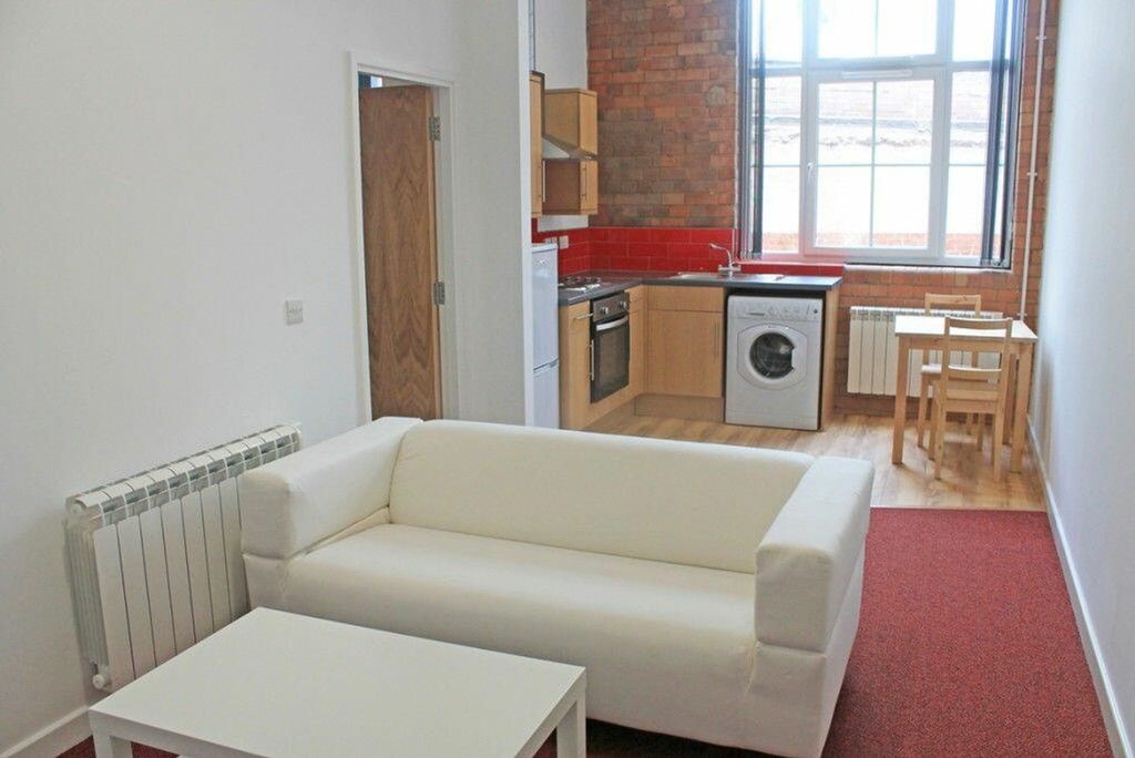 Property photo 1 of 4 A Bright And Inviting Living Room Featuring Large ...