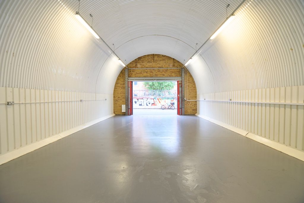 Property photo 1 of 2 An Empty Arch With White Lining, Facing The Front Electric Roller Shutter Entrance, Which Is Open.