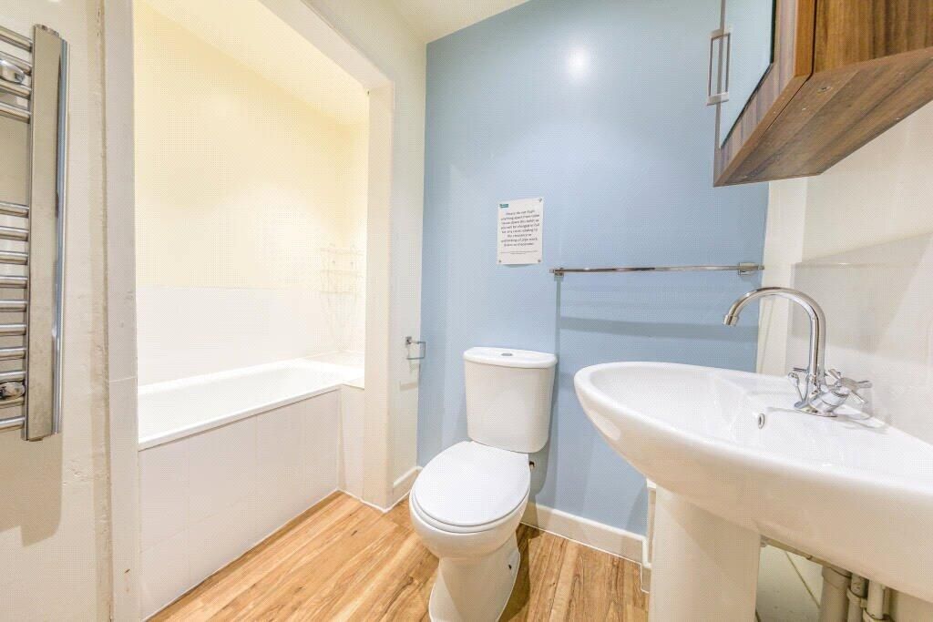 Property photo 2 of 15 A Bright And Modern Bathroom Suite Featuring A Whi...