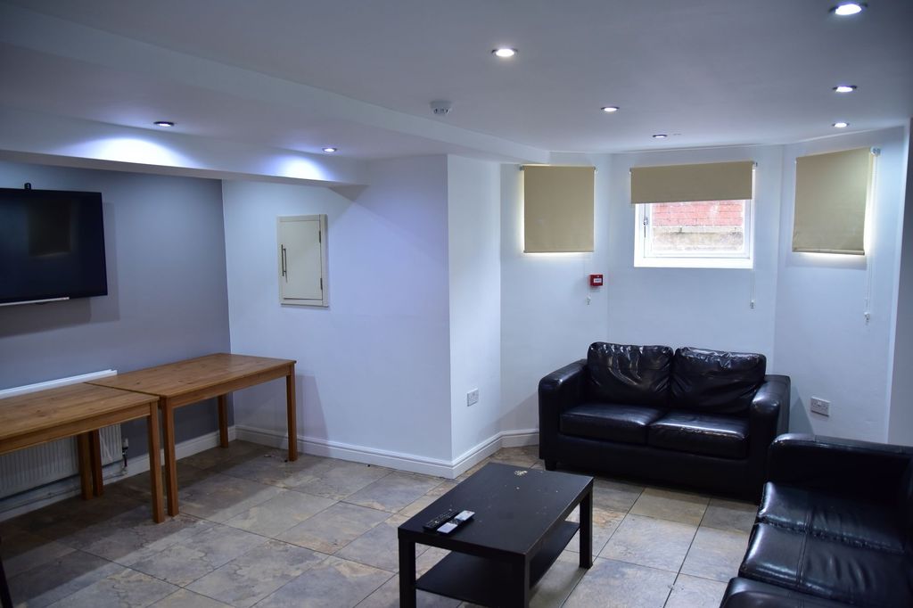 Property photo 1 of 8 A Well-Lit, Modern Living Room Featuring A Comfort...