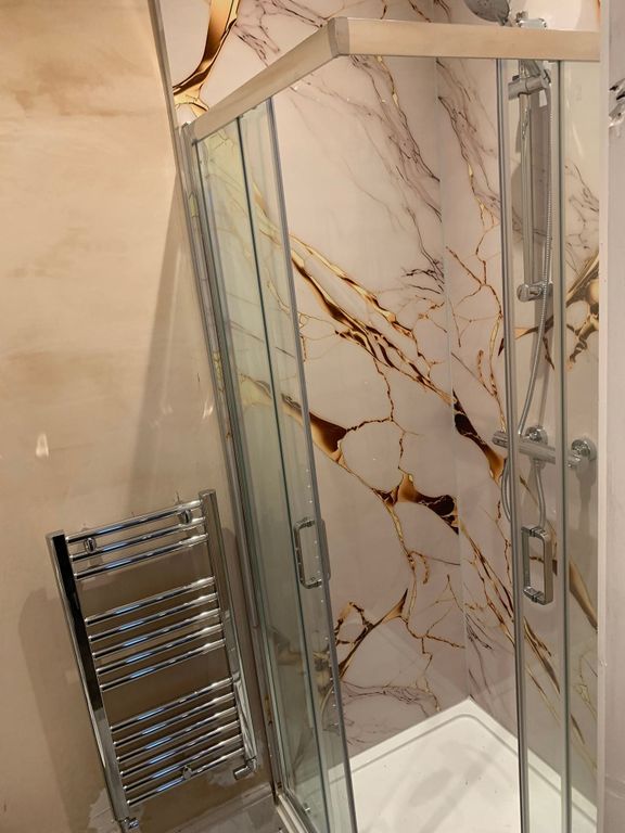 Property photo 2 of 7 Modern Shower With Stylish Marble-Effect Tiling...