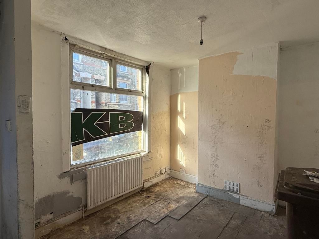 Property photo 2 of 7 Living Room In House In Need Of Refurbishment