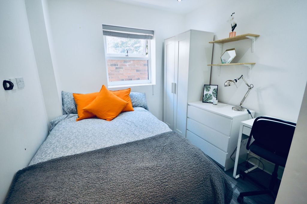 Property photo 2 of 4 A Cozy Bedroom Featuring A Double Bed With Vibrant...