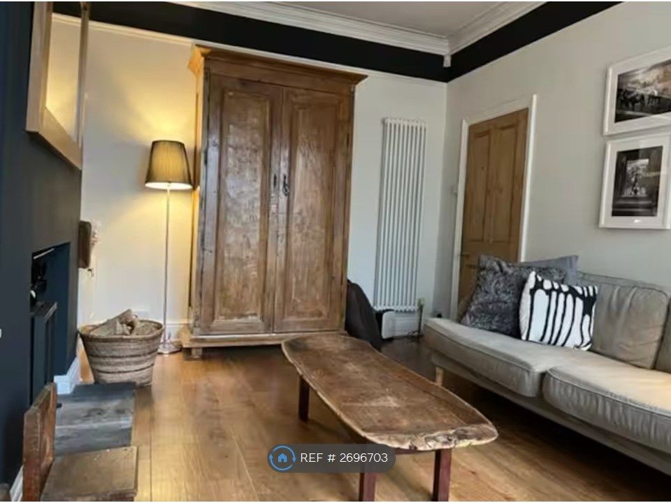 Property photo 2 of 19 Living Room. Triple Glazing. Wood Burner