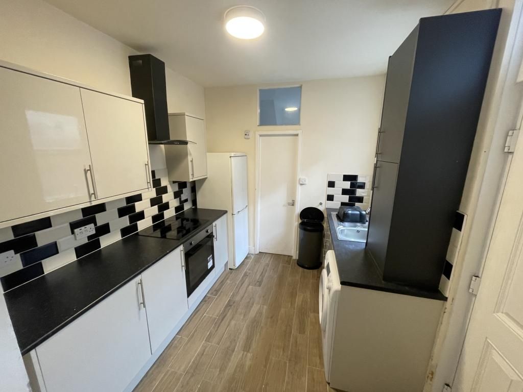 Property photo 3 of 6 This Modern Kitchen Features Sleek Cabinetry And A...