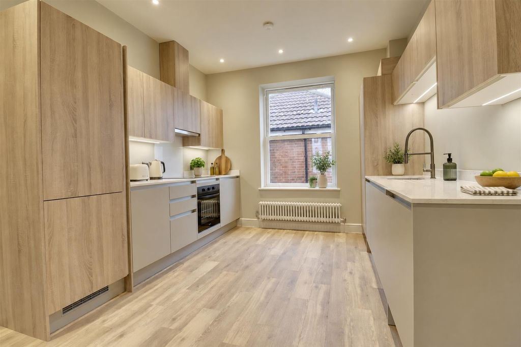 Property photo 3 of 8 Warm Minimalist Galley Kitchen.Png