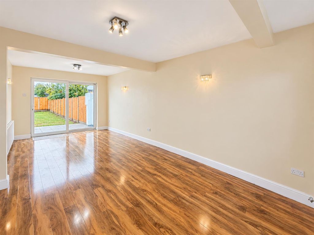 Property photo 1 of 7 Modern Living Room Opening To Garden.Png