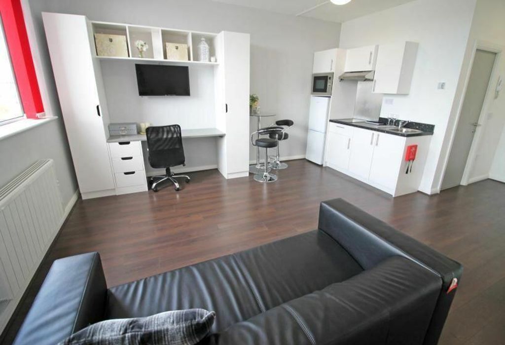 Property photo 3 of 6 This Stylish Double Bedroom Features A Cozy Seatin...
