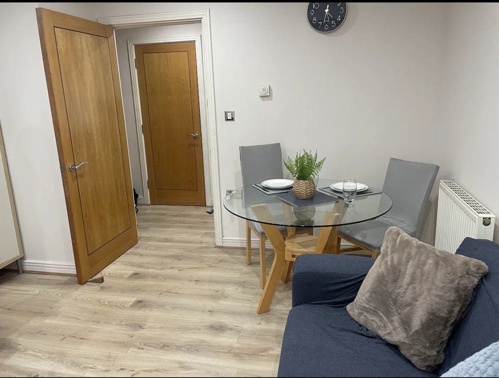 Property photo 3 of 10 A Clean And Inviting Living Room Featuring A Moder...