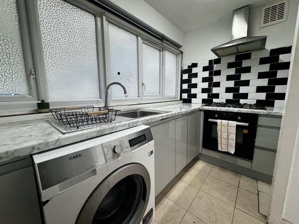 Property photo 1 of 16 Modern Kitchen With Stylish Monochrome Tiling...
