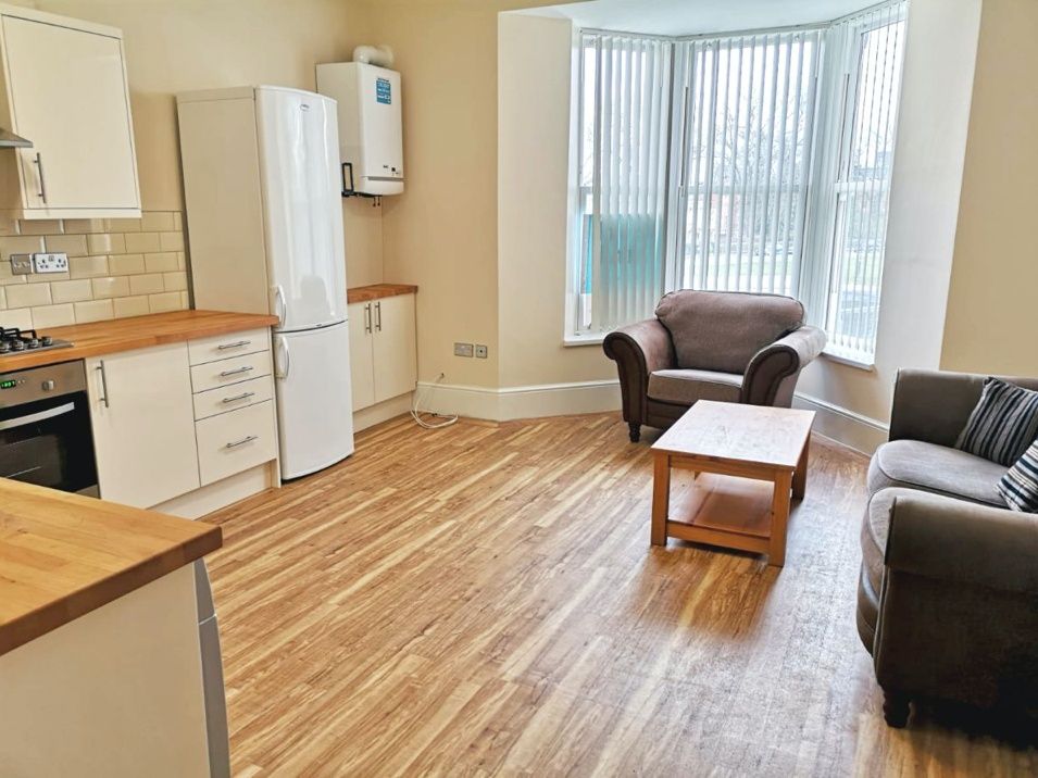 Property photo 1 of 5 Spacious And Bright Living Room Featuring Large Ba...