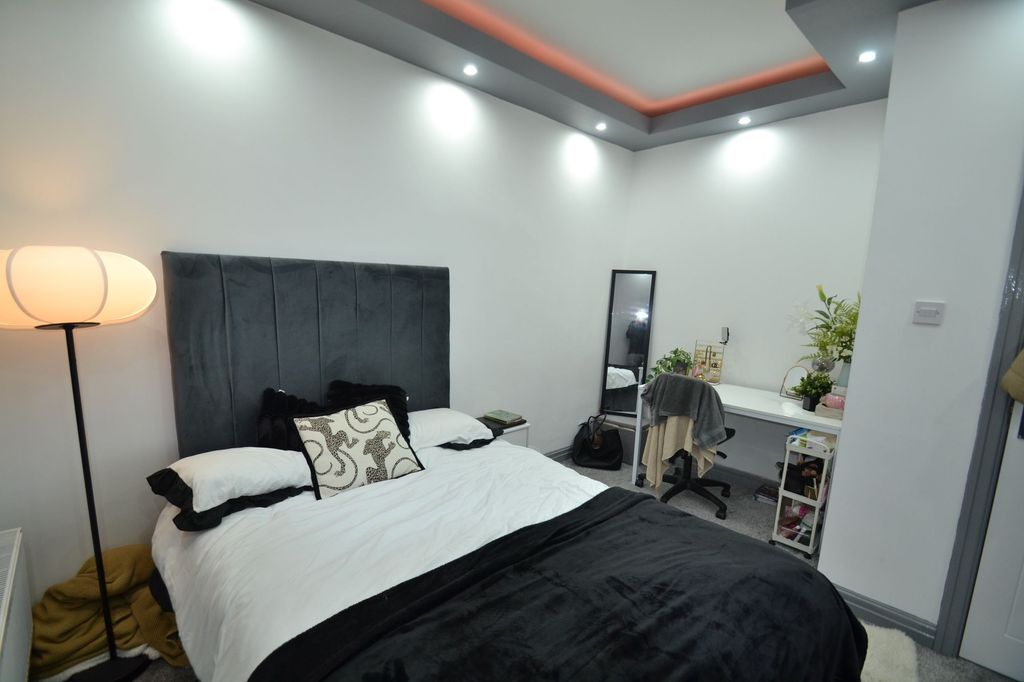 Property photo 3 of 49 Bright, Modern Bedroom With A Plush Upholstered He...