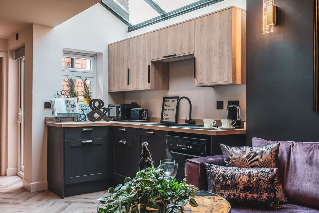 Property photo 2 of 9 Stylish Open-Plan Kitchen Area With Light Wood Wal...