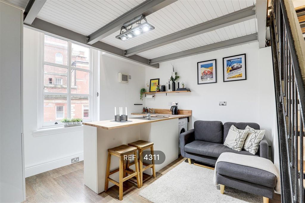 Property photo 2 of 9 Kitchen/Living Area