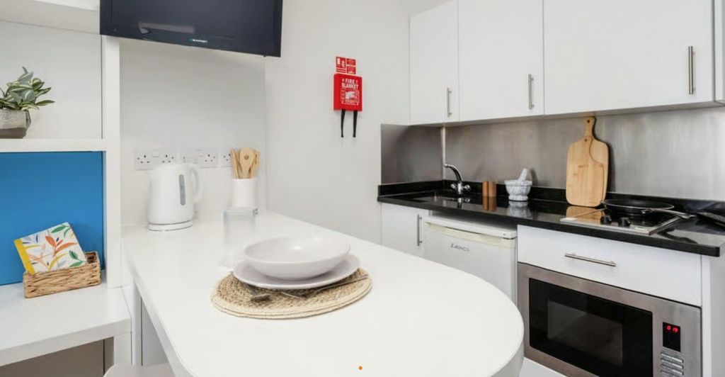 Property photo 3 of 5 Sleek Modern Kitchenette With Breakfast Bar...
