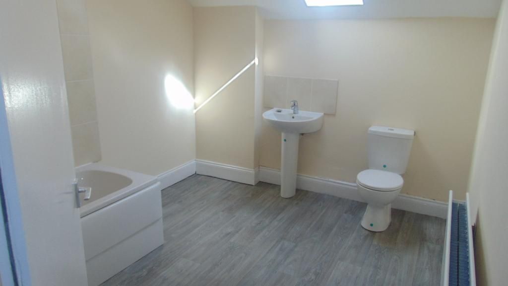 Property photo 3 of 8 Bright And Spacious Bathroom Suite Featuring A Bat...