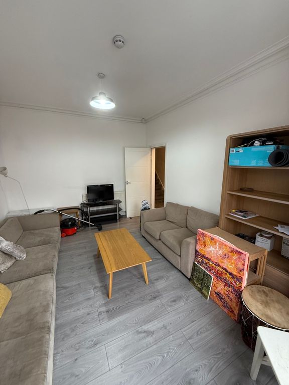 Property photo 3 of 11 A Cozy Living Room Featuring Two Comfortable Sofas...