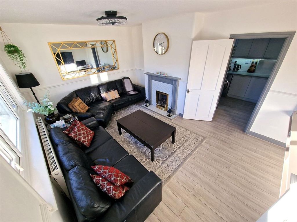 Property photo 1 of 10 A Stylish And Inviting Living Room Featuring A Lar...