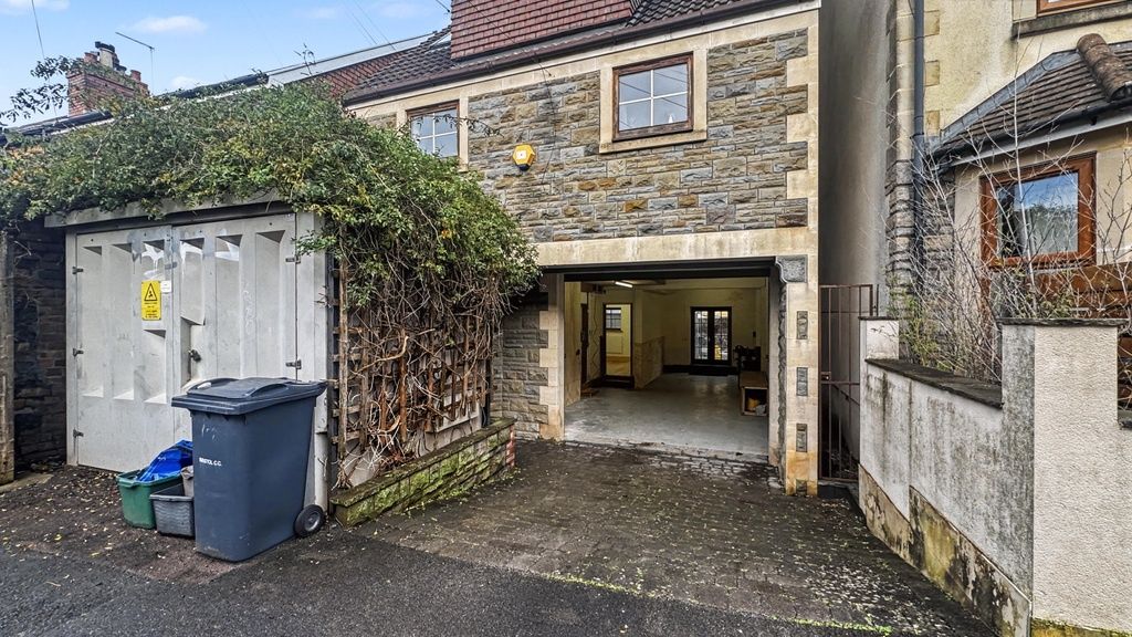 Property photo 1 of 11 Covered Driveway Entrance To A Stone-Fronted Prope...