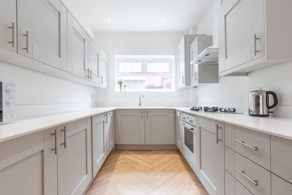 Property photo 3 of 15 Bright, Modern Galley Kitchen With Clean White Wor...