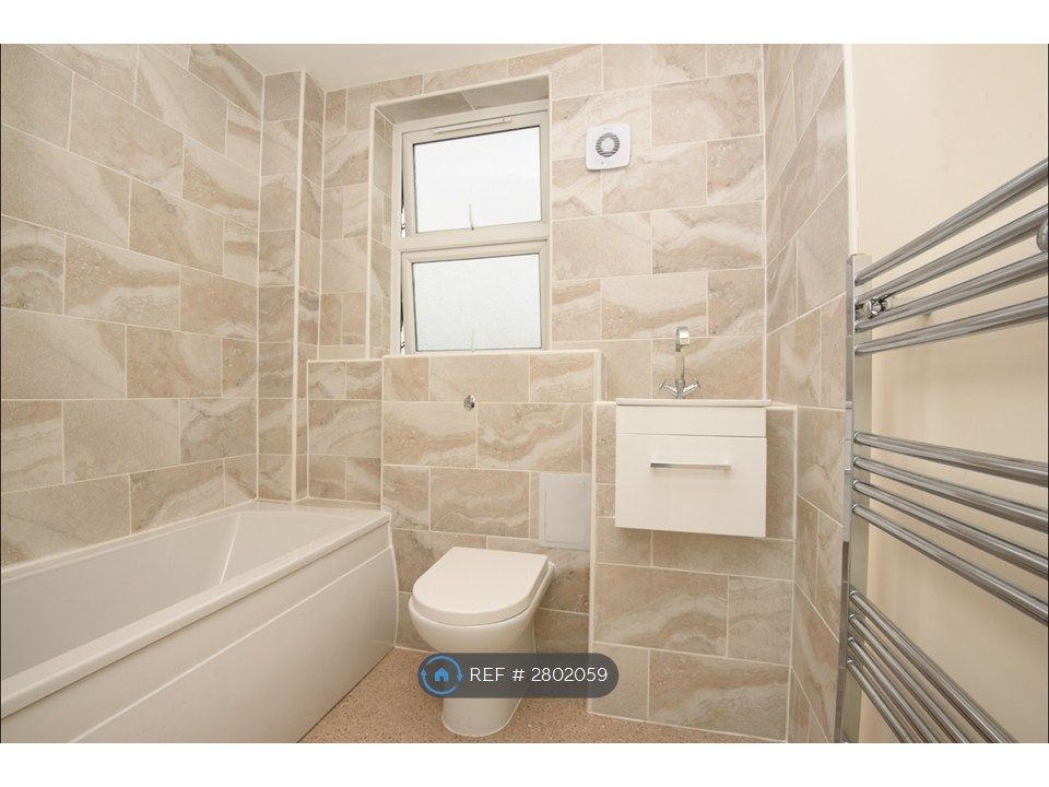 Property photo 2 of 8 Fresh-Clean Bathroom