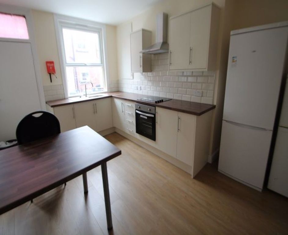 Property photo 1 of 15 Bright And Modern Kitchen Featuring Ample Countert...