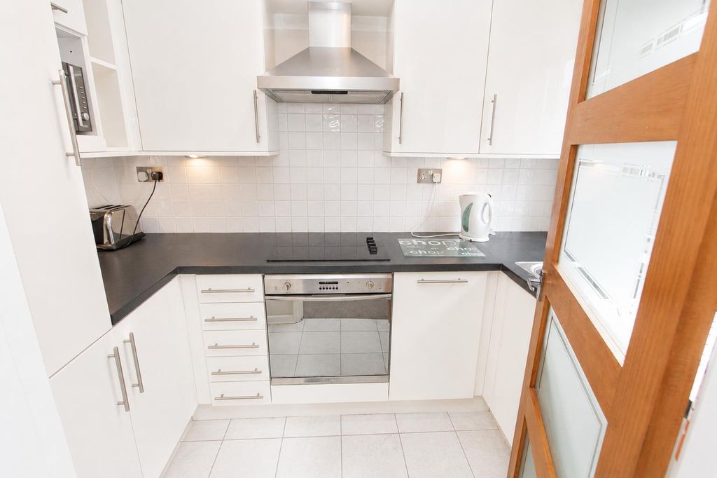 Property photo 3 of 7 Modern White Kitchen With Integrated Appliances...