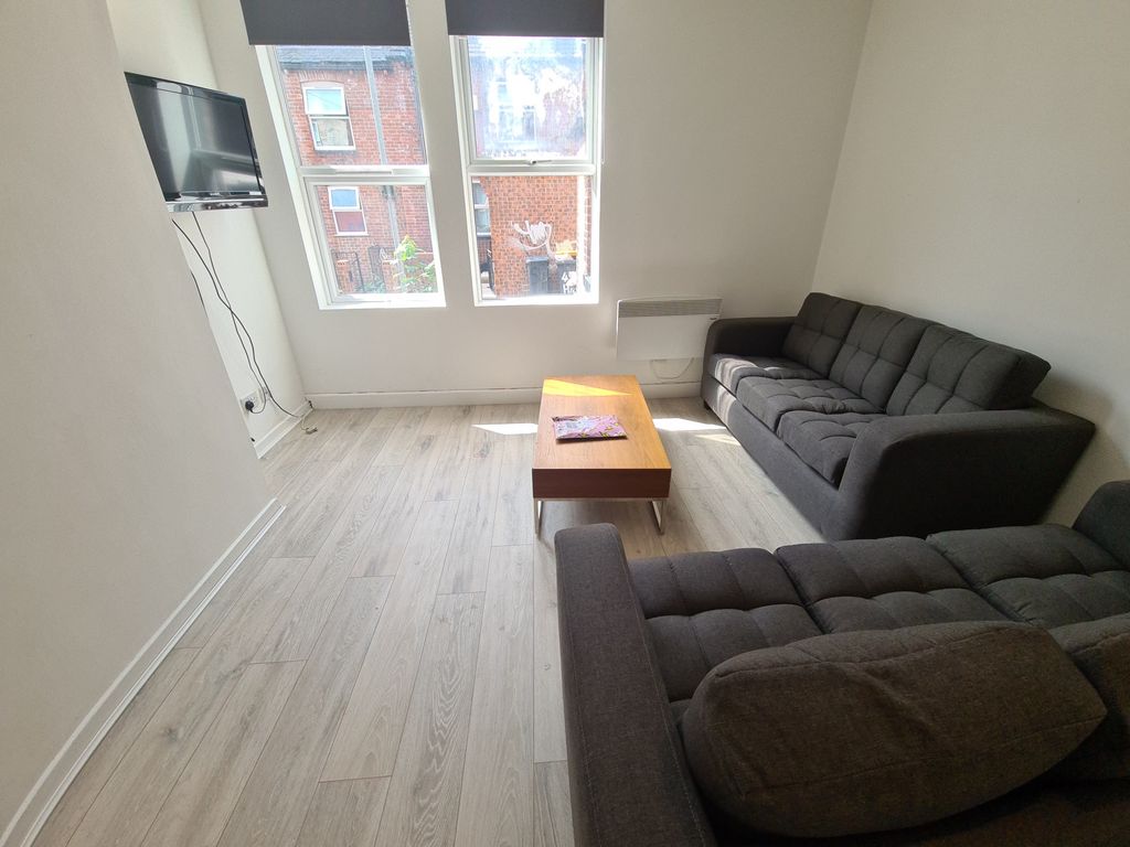 Property photo 2 of 13 A Bright And Inviting Living Room Featuring Two La...