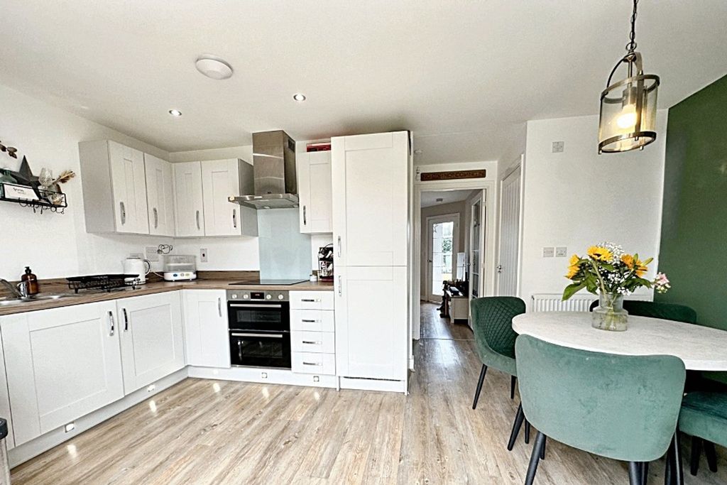 Property photo 3 of 13 Dining Kitchen
