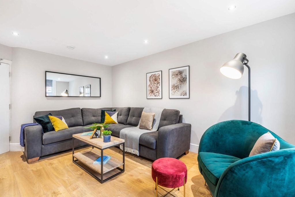 Property photo 1 of 10 Bright, Modern Living Room With A Comfy Grey Sofa,...
