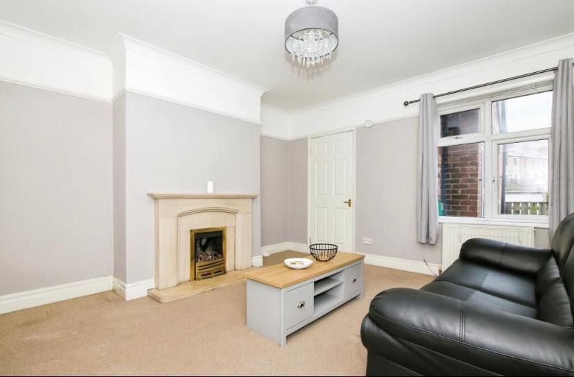 Property photo 3 of 9 Bright, Neutral Living Room With A Classic Firepla...