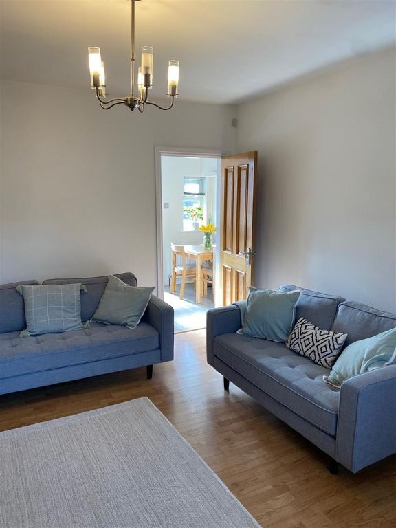 Property photo 3 of 8 Bright Lounge With Stylish Sofas And Wood Floors...