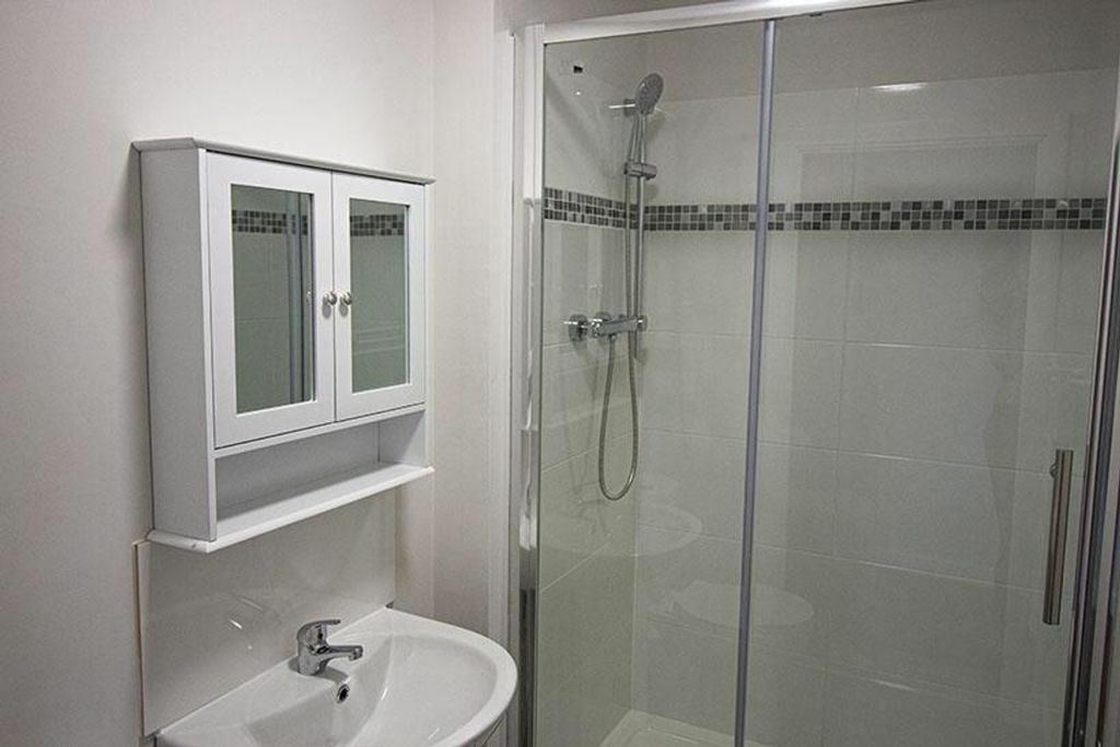 Property photo 3 of 4 Modern Bathroom Featuring A Sleek Shower Enclosure...