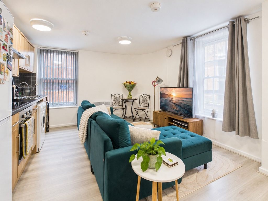 Property photo 3 of 11 Bright Teal Sofa Open-Plan Interior