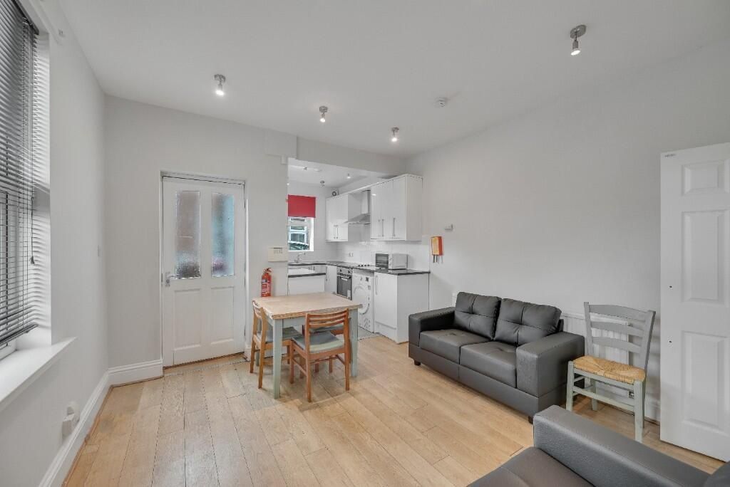 Property photo 3 of 11 Bright And Modern Kitchen Area Featuring White Cab...