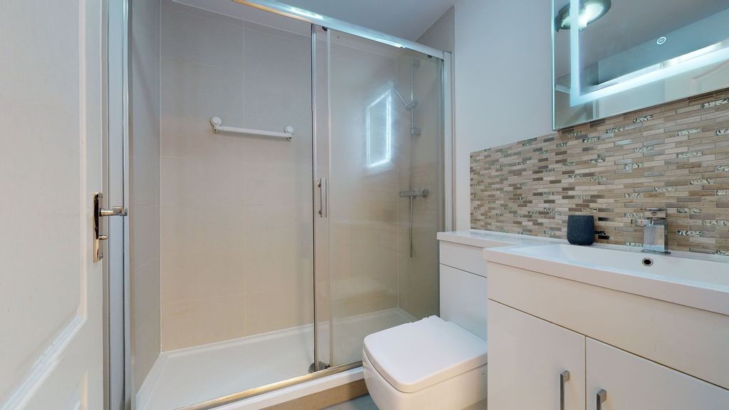 Property photo 2 of 13 Modern Bathroom Featuring A Spacious Shower Enclos...