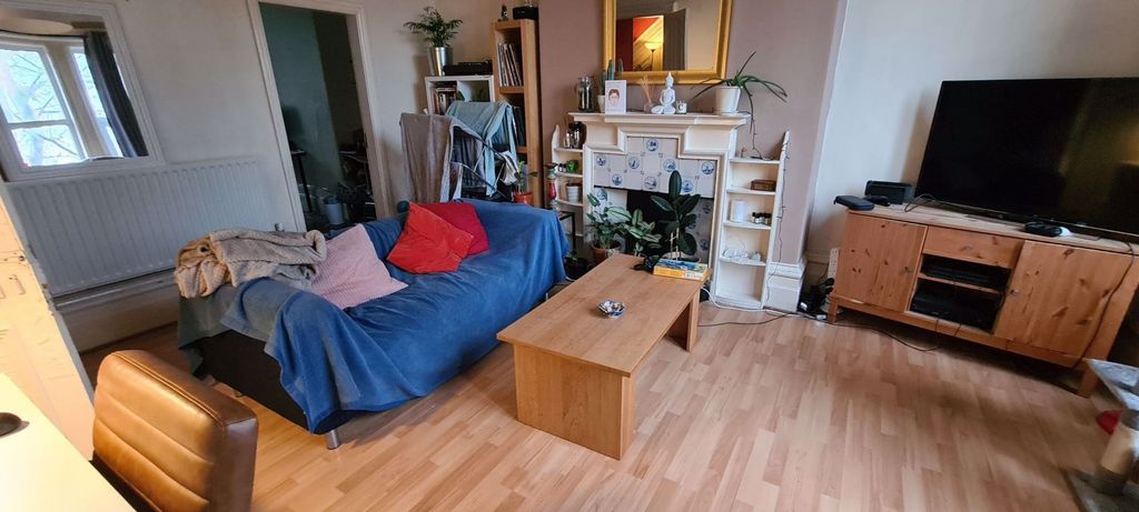 Property photo 2 of 9 A Bright And Spacious Living Room Featuring A Comf...