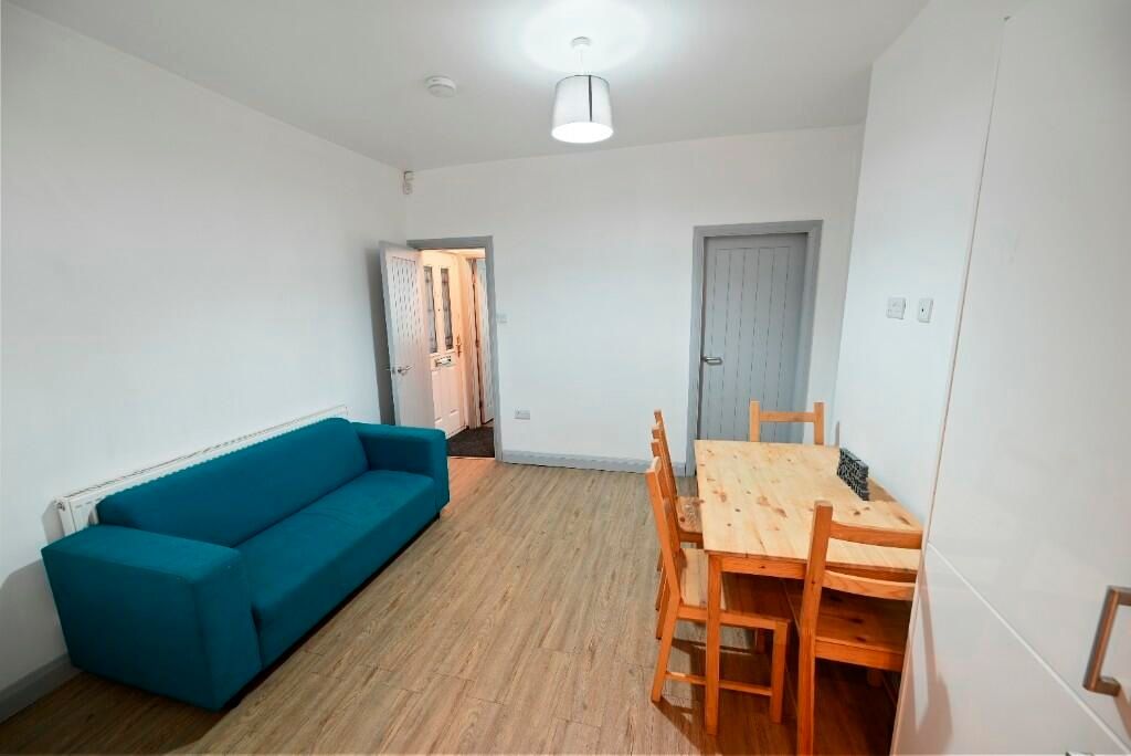Property photo 3 of 15 A Clean And Inviting Living Room Featuring A Comfo...