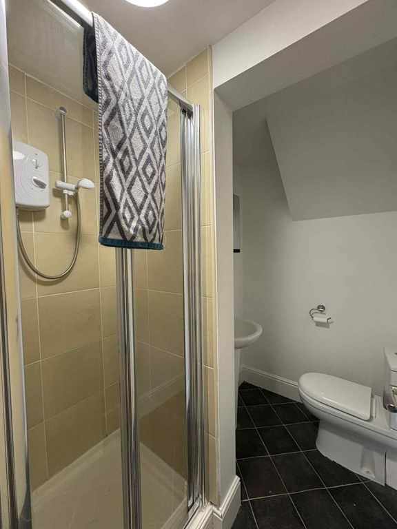 Property photo 3 of 14 A Modern Bathroom Featuring A Shower Unit With Bei...