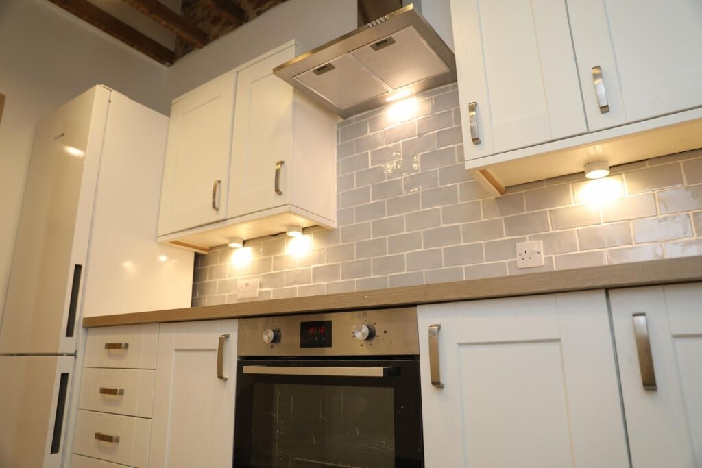 Property photo 1 of 7 Modern Kitchen With Sleek White Cabinets...