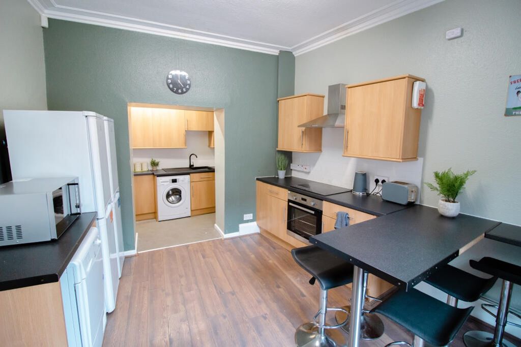 Property photo 2 of 3 Bright And Modern Kitchen Featuring Sleek Cabinetr...