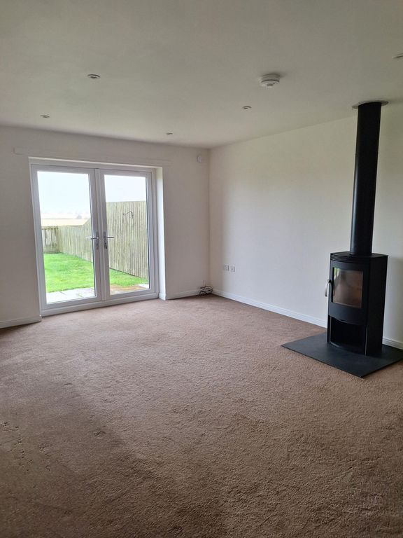 Property photo 3 of 8 Lounge With Woodburner