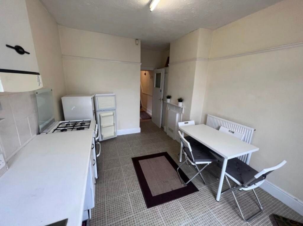 Property photo 3 of 6 Bright And Clean Kitchen Featuring A Gas Stove, Wh...