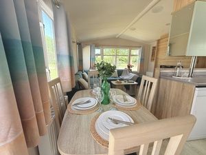 Property photo 3 of 5 Dining Area With Table And Four Chairs Beside The Kitchen