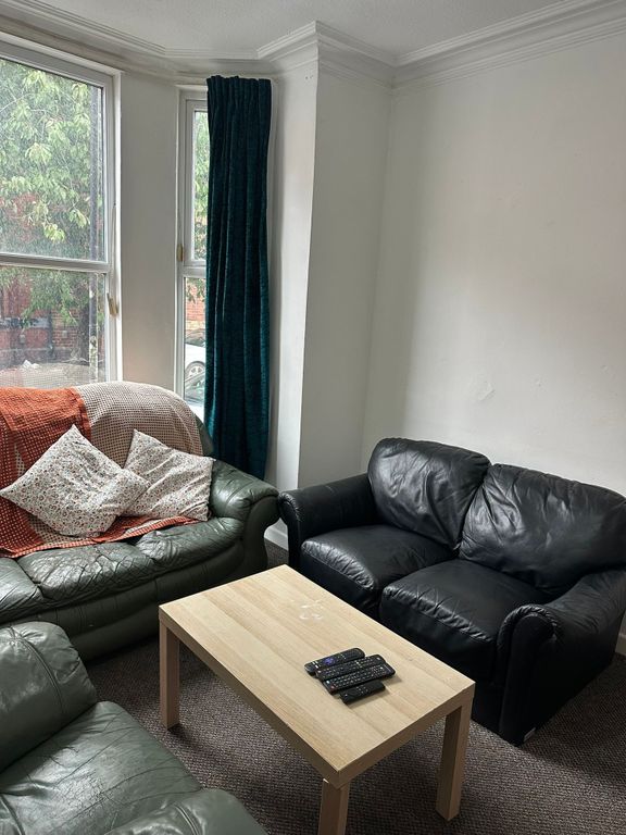 Property photo 3 of 19 A Cozy Living Room Featuring Two Leather Sofas, A ...